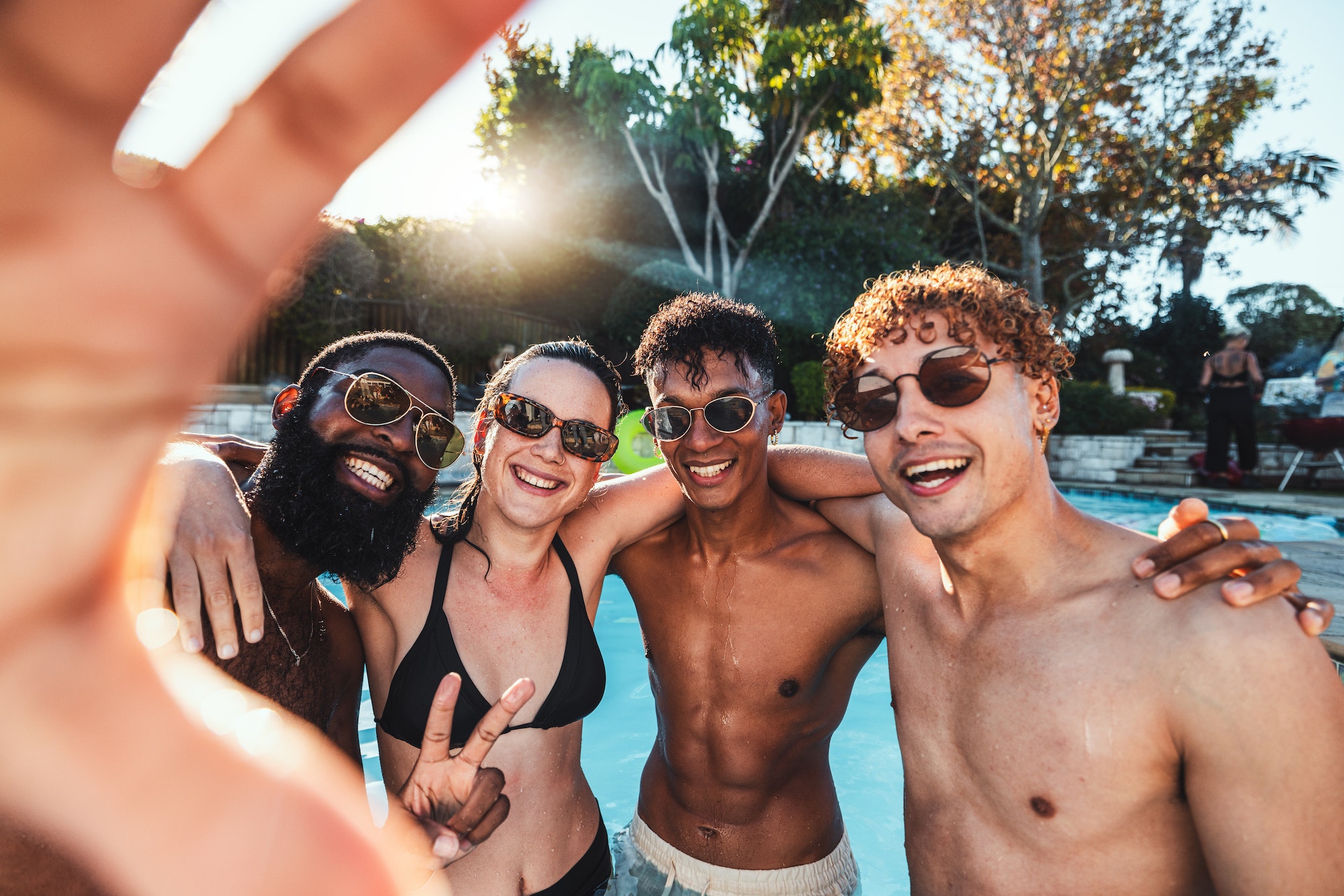 Peace sign, friends selfie and pool party, having fun or partying on new year. Swimming celebration